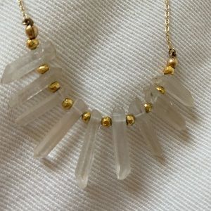 Clear mineral quartz and gold necklace